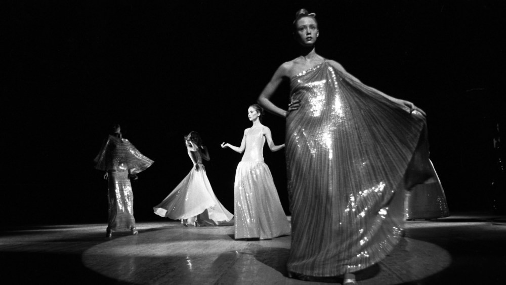 Outtake; Models in costume stand onstage during the fashion show to benefit the restoration of the Chateau of Versailles, five American designers matching talents with five French couturiers at the Versailles Palace on November 28, 1973 in Versailles, France.Article title: "One night and pouf! It's gone!"