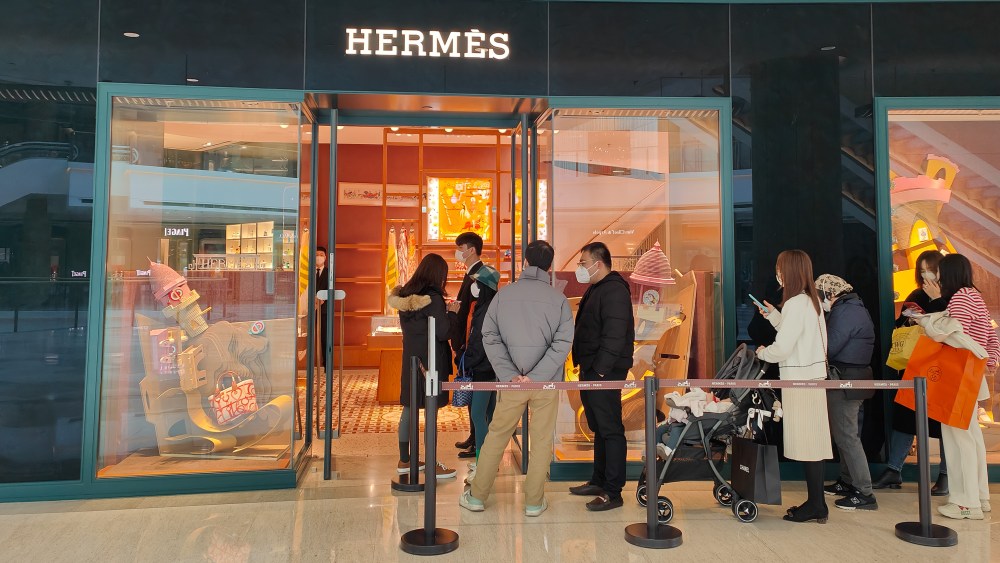 Shoppers line up at Hermès luxury store in Shanghai, China, February 1, 2023.