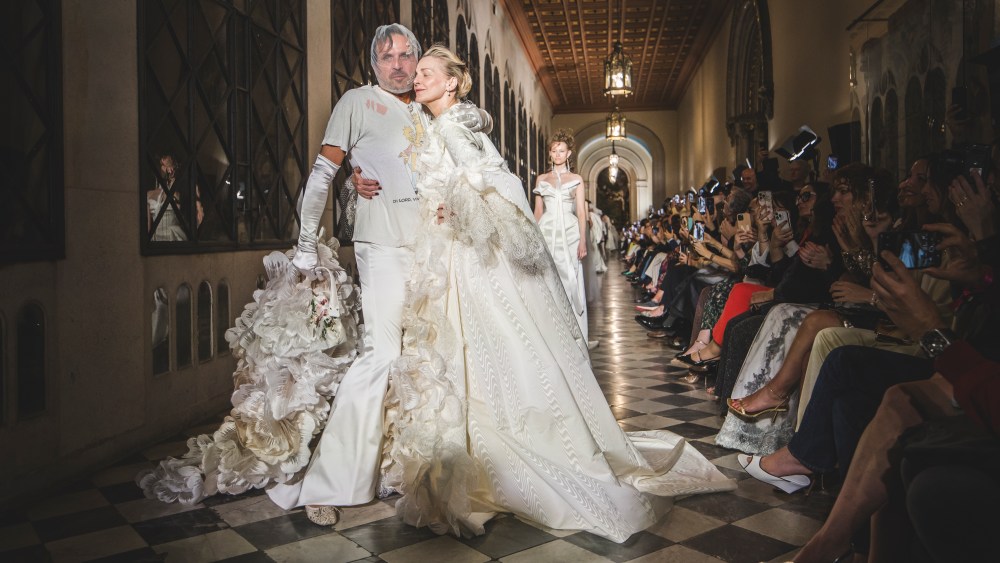 BARCELONA, SPAIN - APRIL 24: Fashion designer Andreas Kronthaler (L) and Simonetta Gianfelici walk the runway at the Vivienne Westwood fashion show during Barcelona Bridal Fashion Week 2025 at the Universitat de Barcelona on April 24, 2025 in Barcelona, Spain. (Photo by Xavi Torrent/Getty Images)