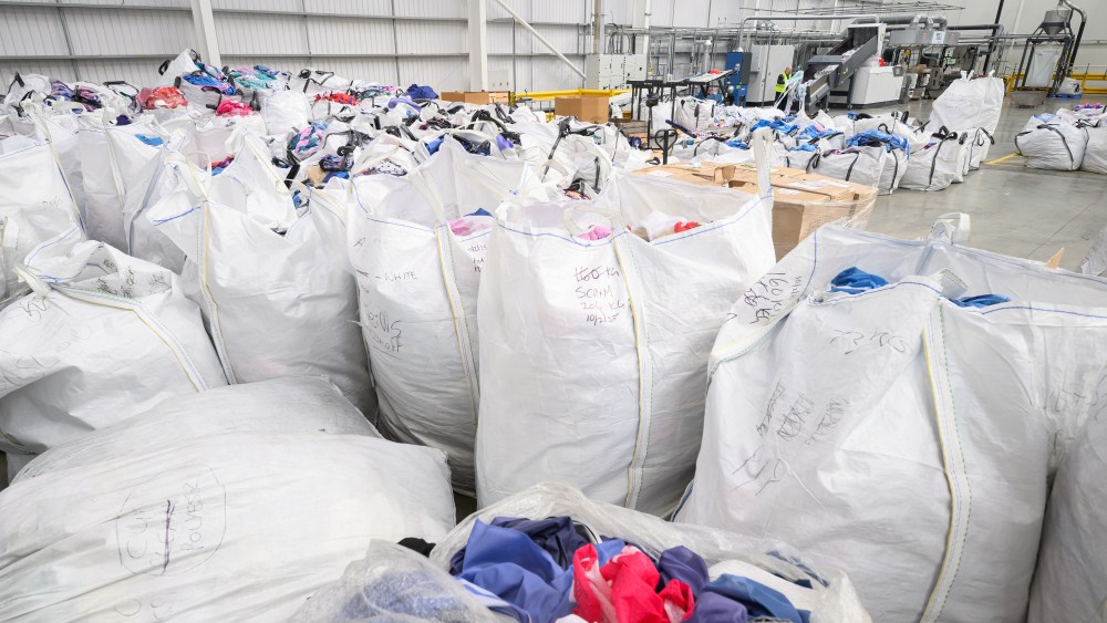 textiles waste, textiles waste in bags waiting to be sorted and recylced